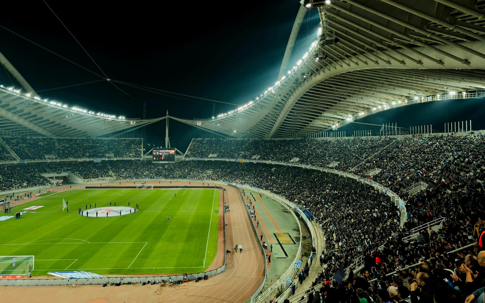 Floodlit football ground on match night
